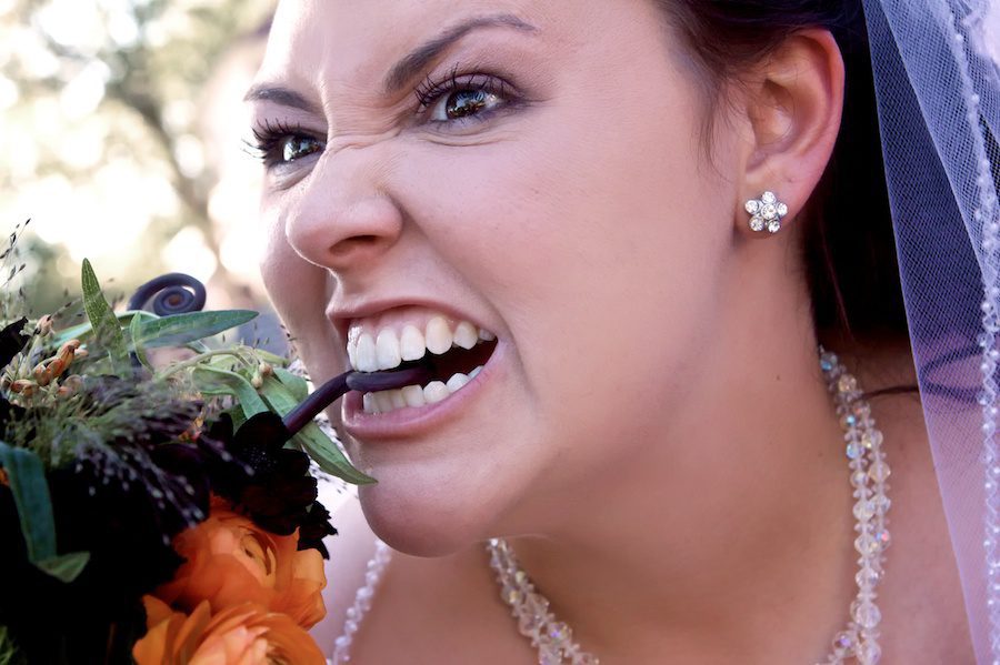 funny photo of bride and wedding bouquet
