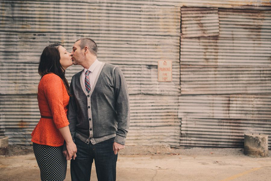 engagement photos at the goat farm in front of no parking sign