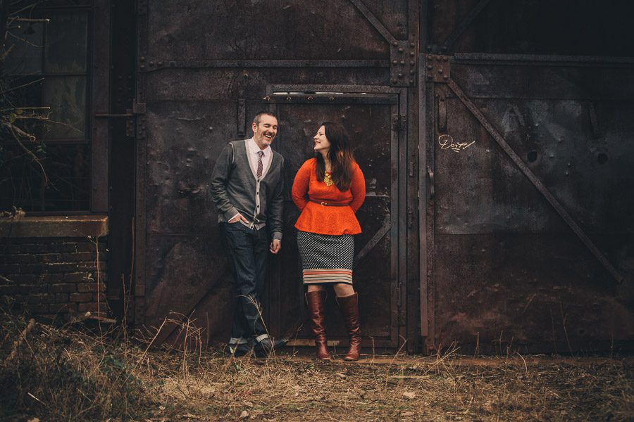 laughing portrait of engaged couple at the atlanta goat farm