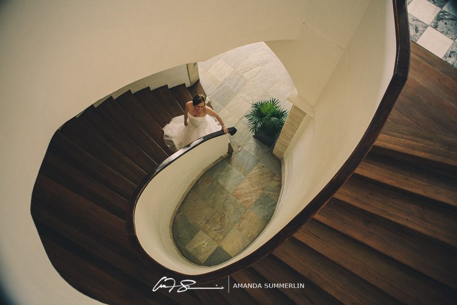 photograph of bride on stairs at sugar beach resort for destination wedding