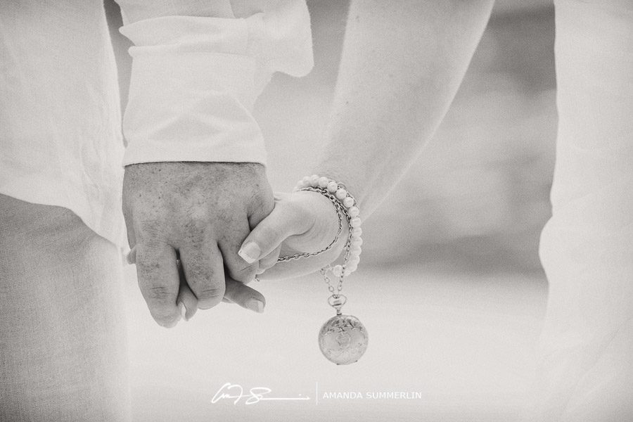 bride and groom hold hands during destination beach wedding in st lucia