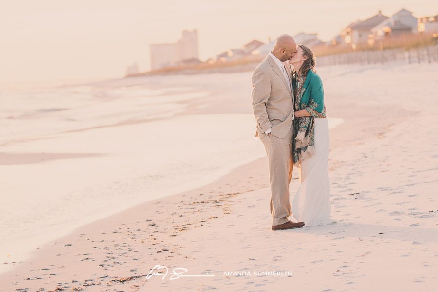 florida beach destination wedding bride and groom kiss at sunset