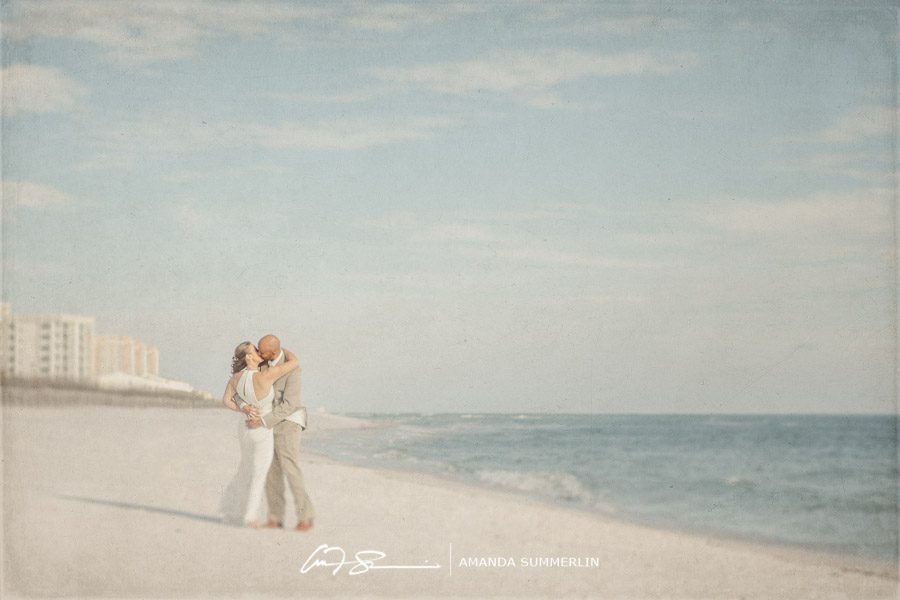 florida destination beach wedding bride and groom kiss on beach