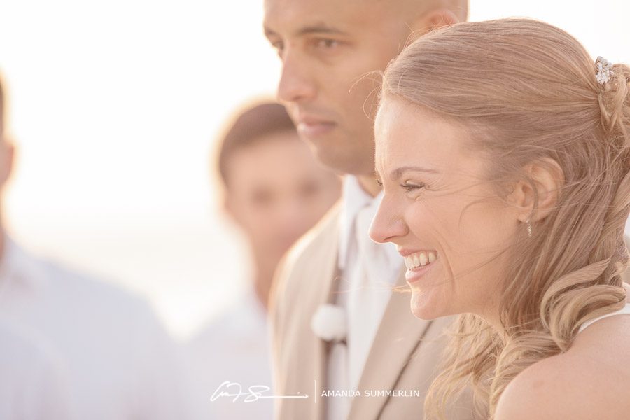 bride smiles during florida beach wedding ceremony