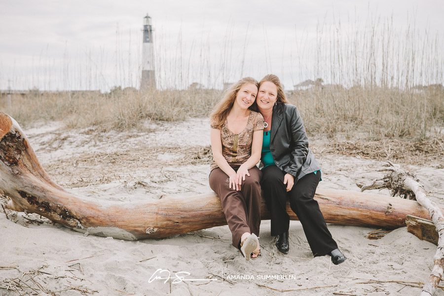 sister photograph by tybee lighthouse on beach