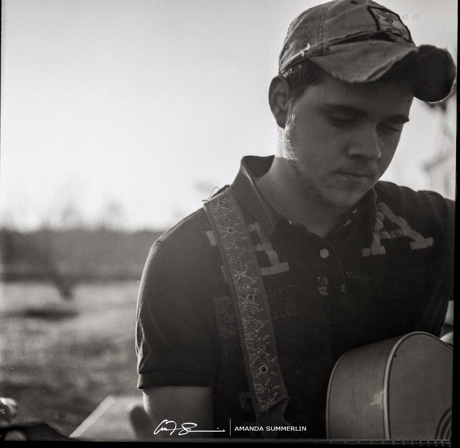 black and white film photo of country musician James Burkett