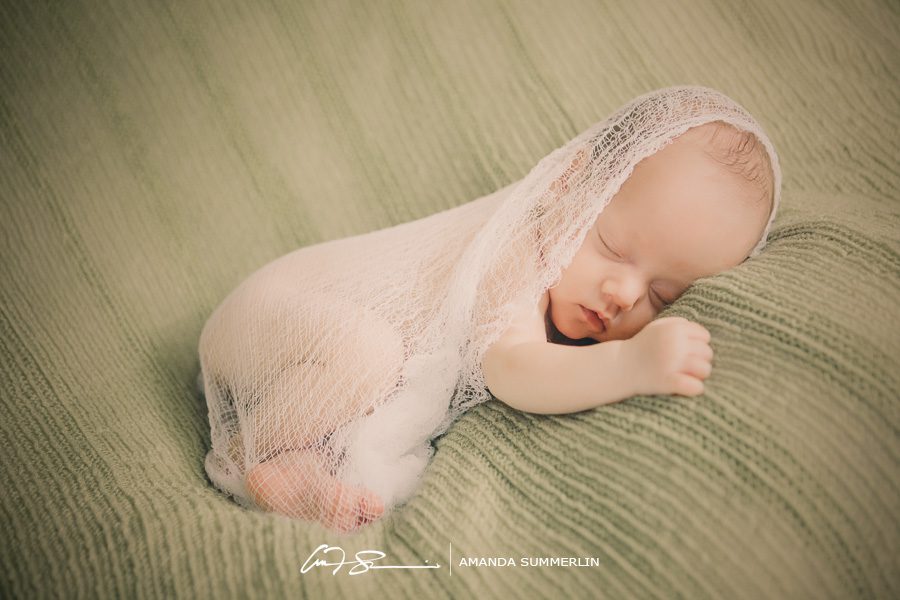 Newborn photo with white wrap