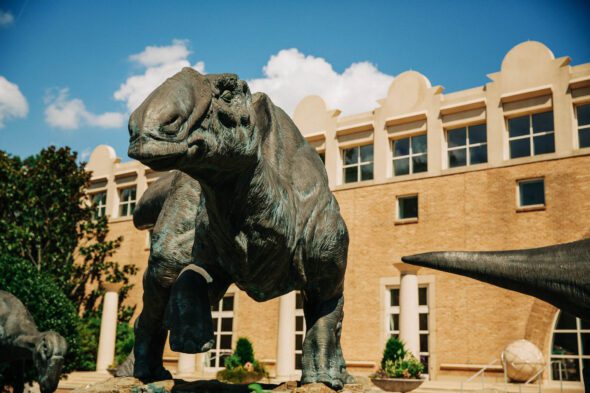 A close-up of the dinosaur statue in front of Fern Bank science center in Atlanta