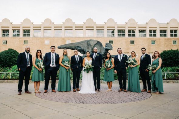 A photo of a wedding party standing in front of Fern Bank science center