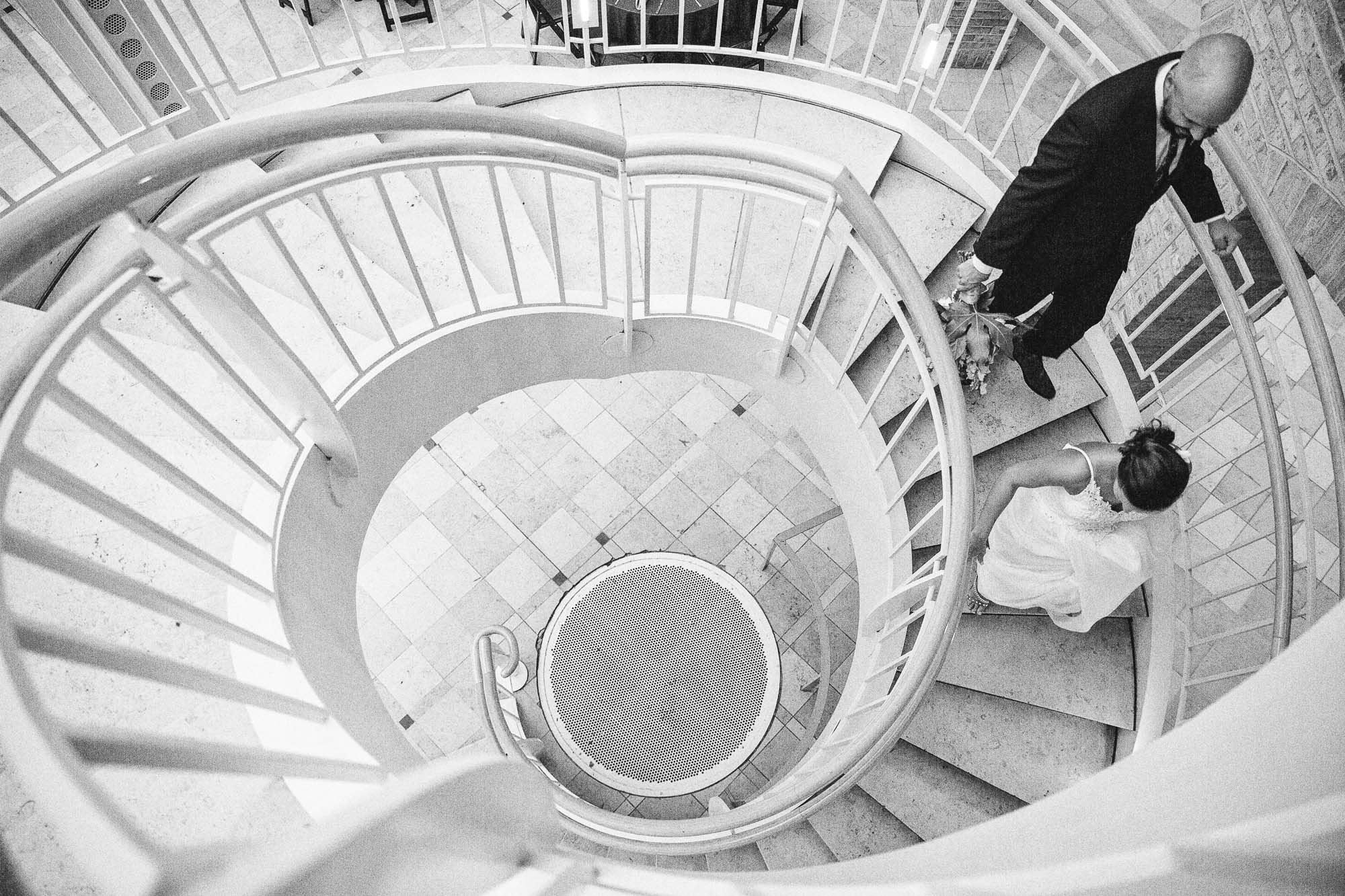 Black and white photo looking down a spiral staircase at Fernbank museum