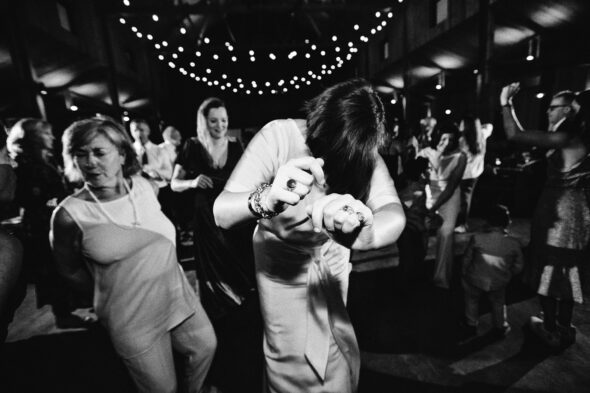 black and white photo of people dancing at wedding reception