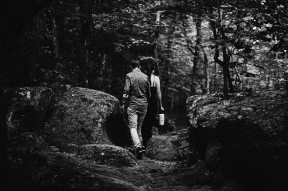 black and white photo of a couple hiking for their adventure engagement photo session