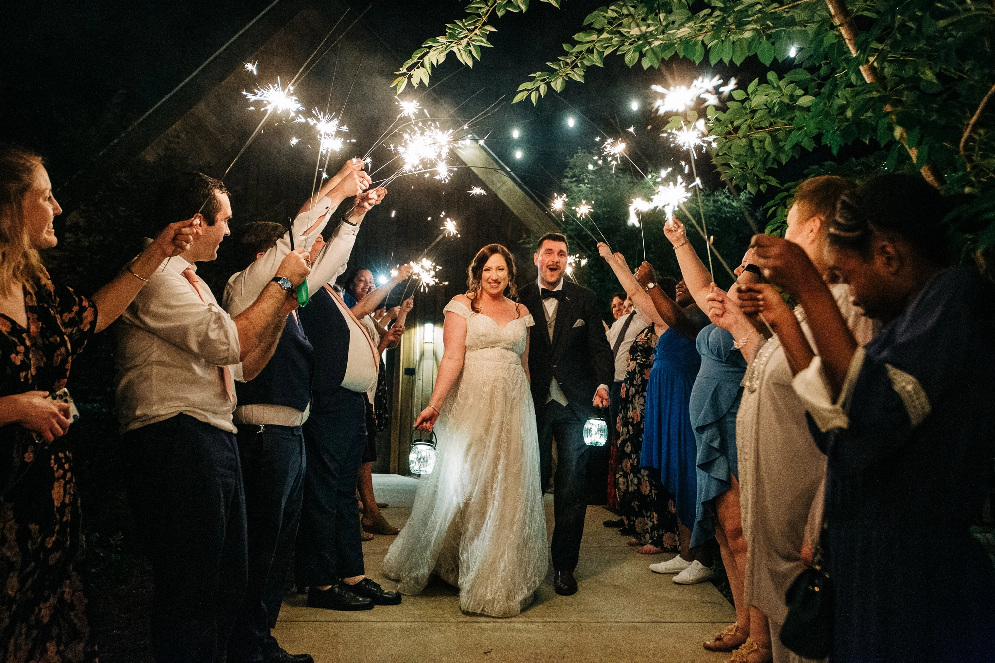 documentary wedding photographer captures the newlyweds enjoying their sparkler send off