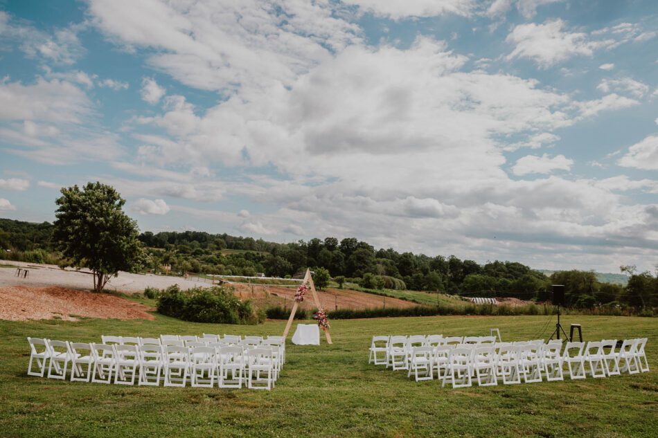 the lawn of Rising Silo Brewery in Blacksburg Virginia is set up with chairs for a wedding