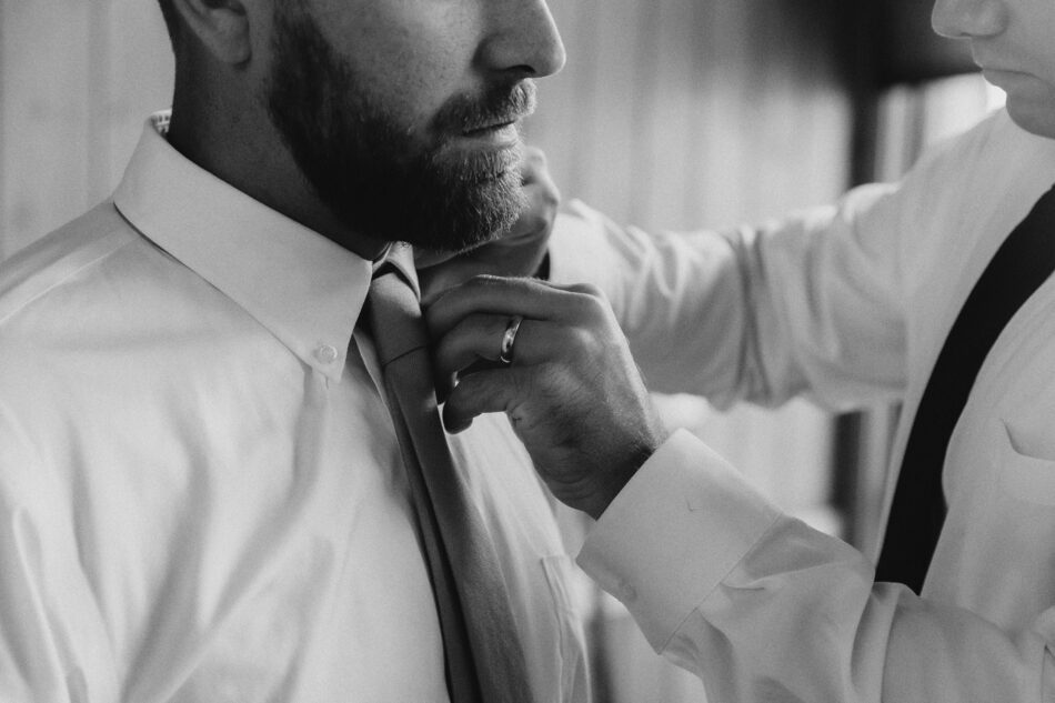 a groom gets ready in lake guntersville state park chalet