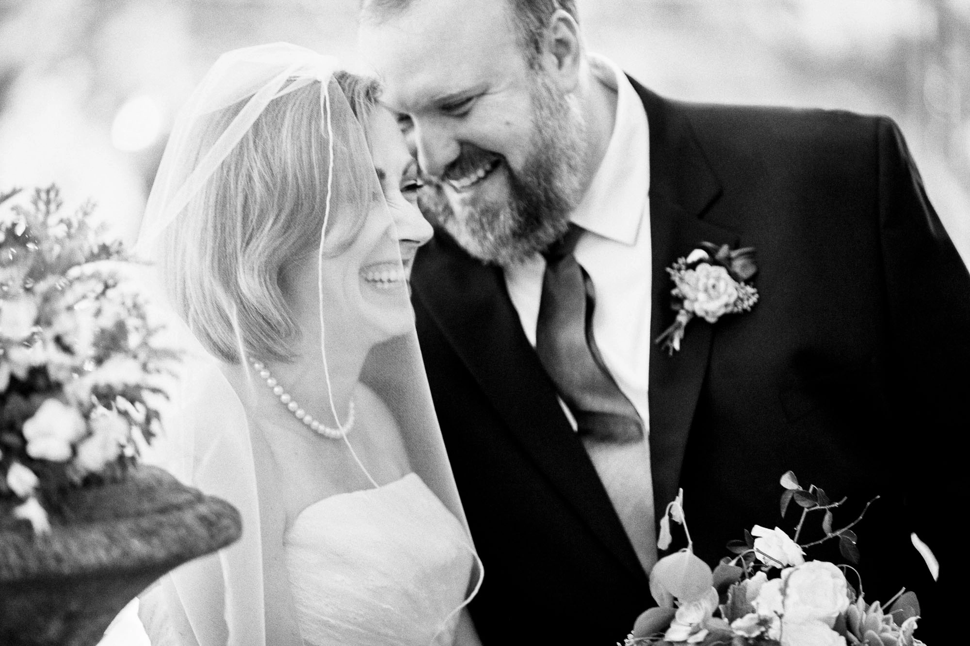 a bride and a groom laugh together on their wedding day at The Georgian Terrace in Atlanta