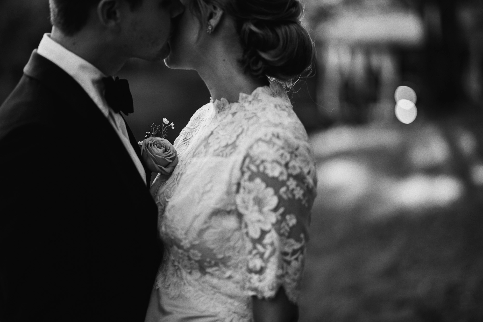 a bride and a groom embrace on their wedding day