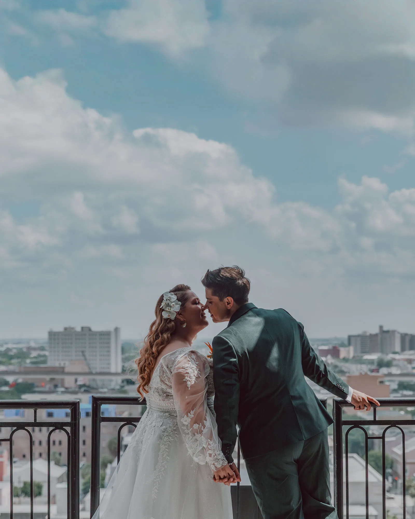 an lgbtq couple leans in for a kiss on their wedding day
