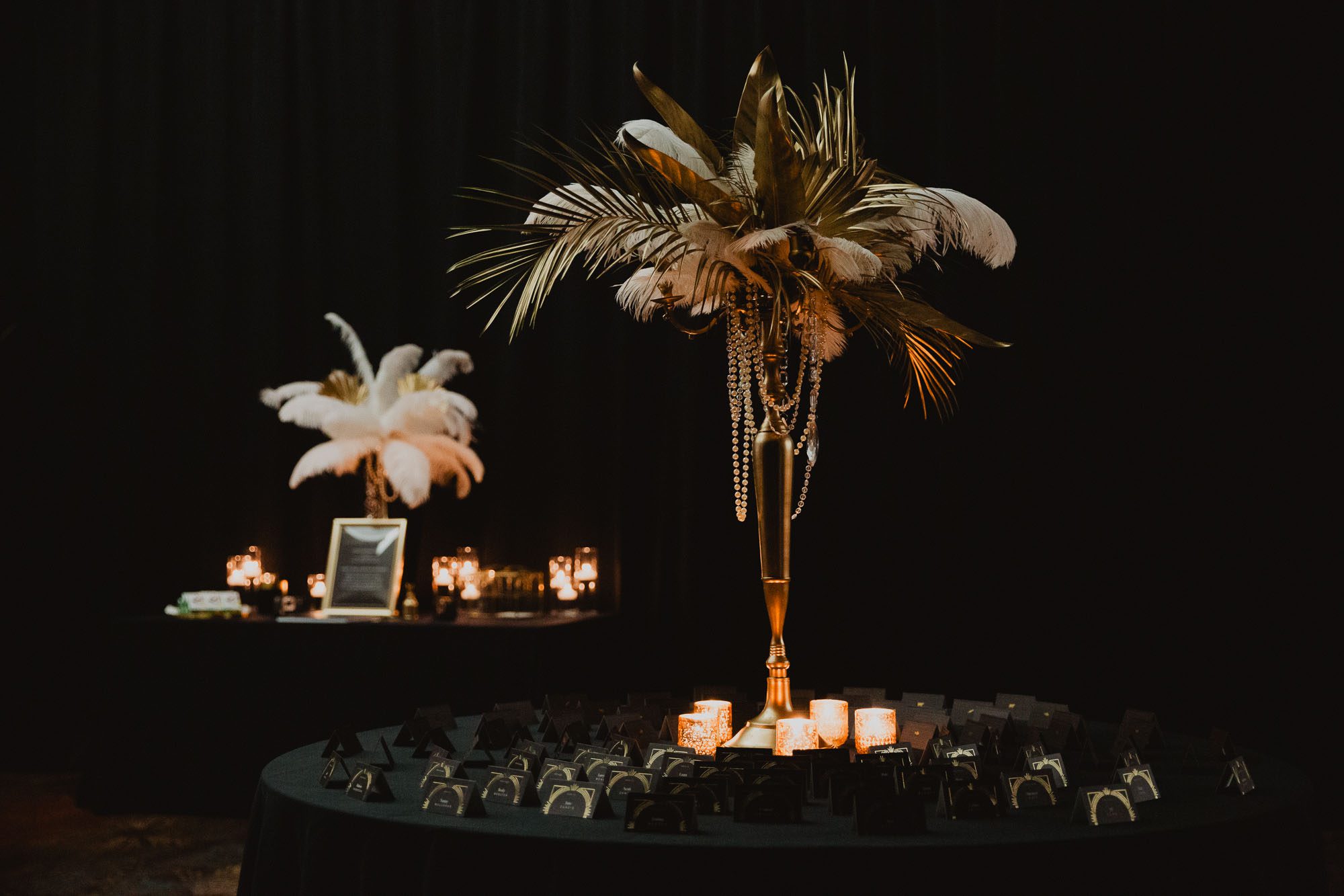 1920s great Gatsby inspired floral centerpiece on table at wedding reception