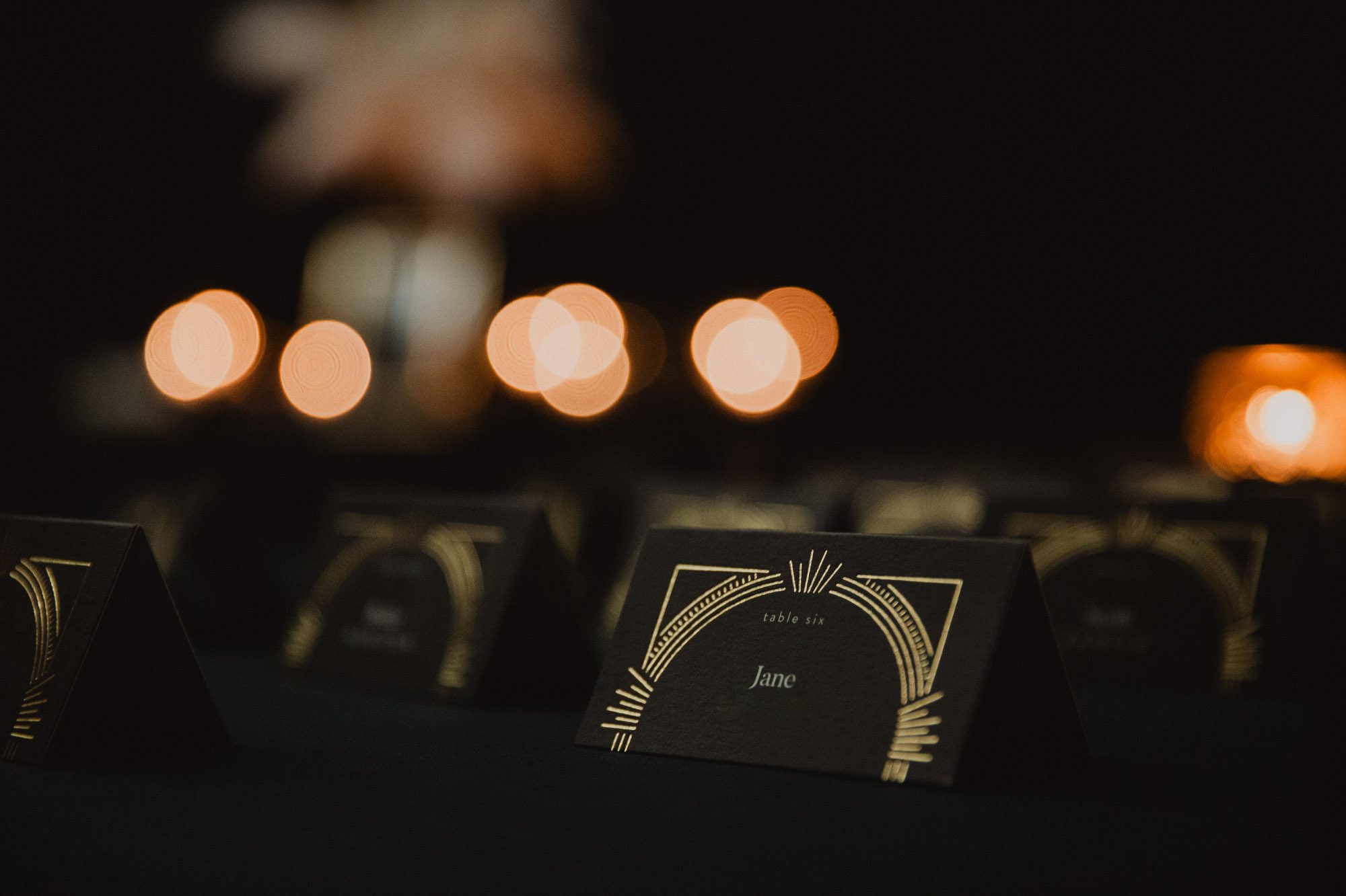 1920s great Gatsby inspired escort card on table at wedding reception
