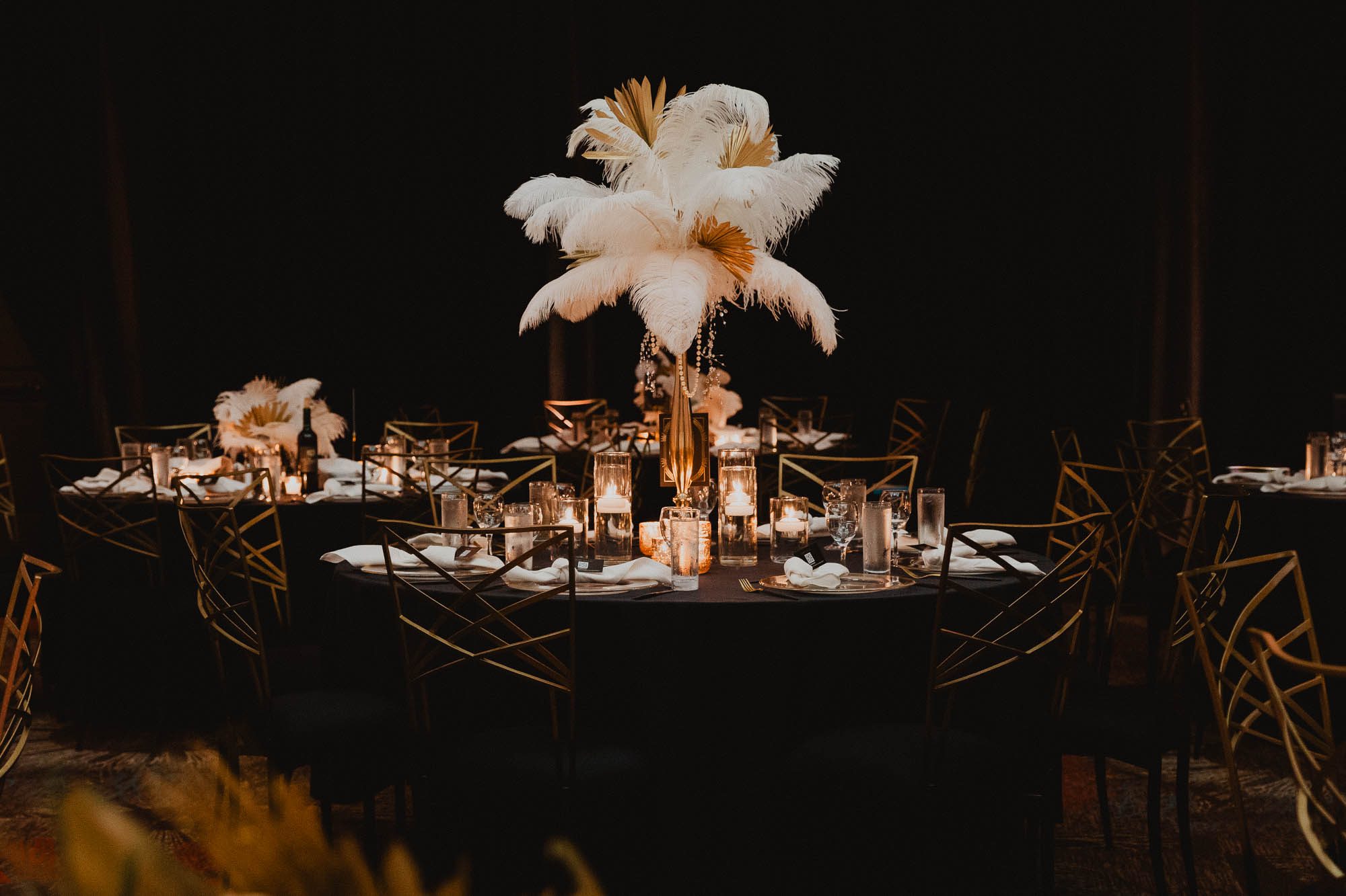 1920s great Gatsby inspired floral centerpiece on table at wedding reception