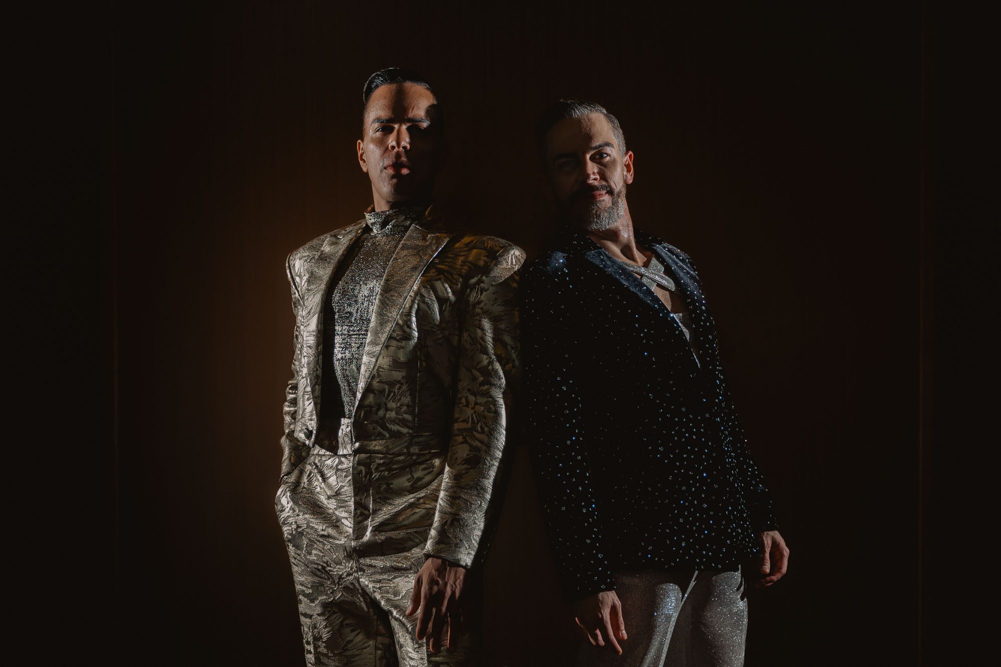 newlywed grooms wearing Christian Siriano suits
