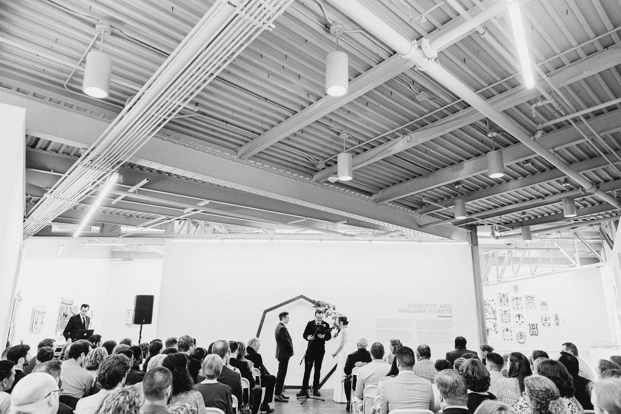 black and white documentary photo of an indoor wedding ceremony at the Atlanta Contemporary