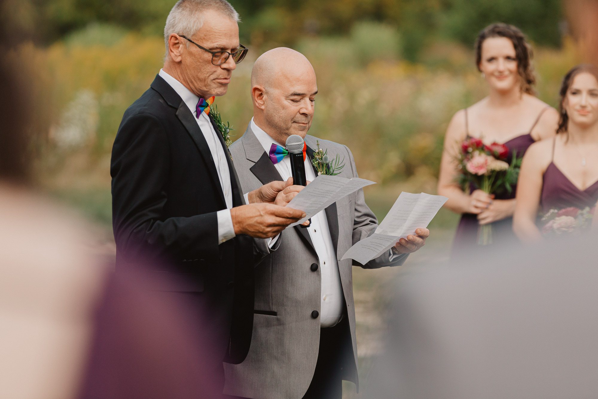 two guncles read a poem to their niece during her lgbtq wedding ceremony