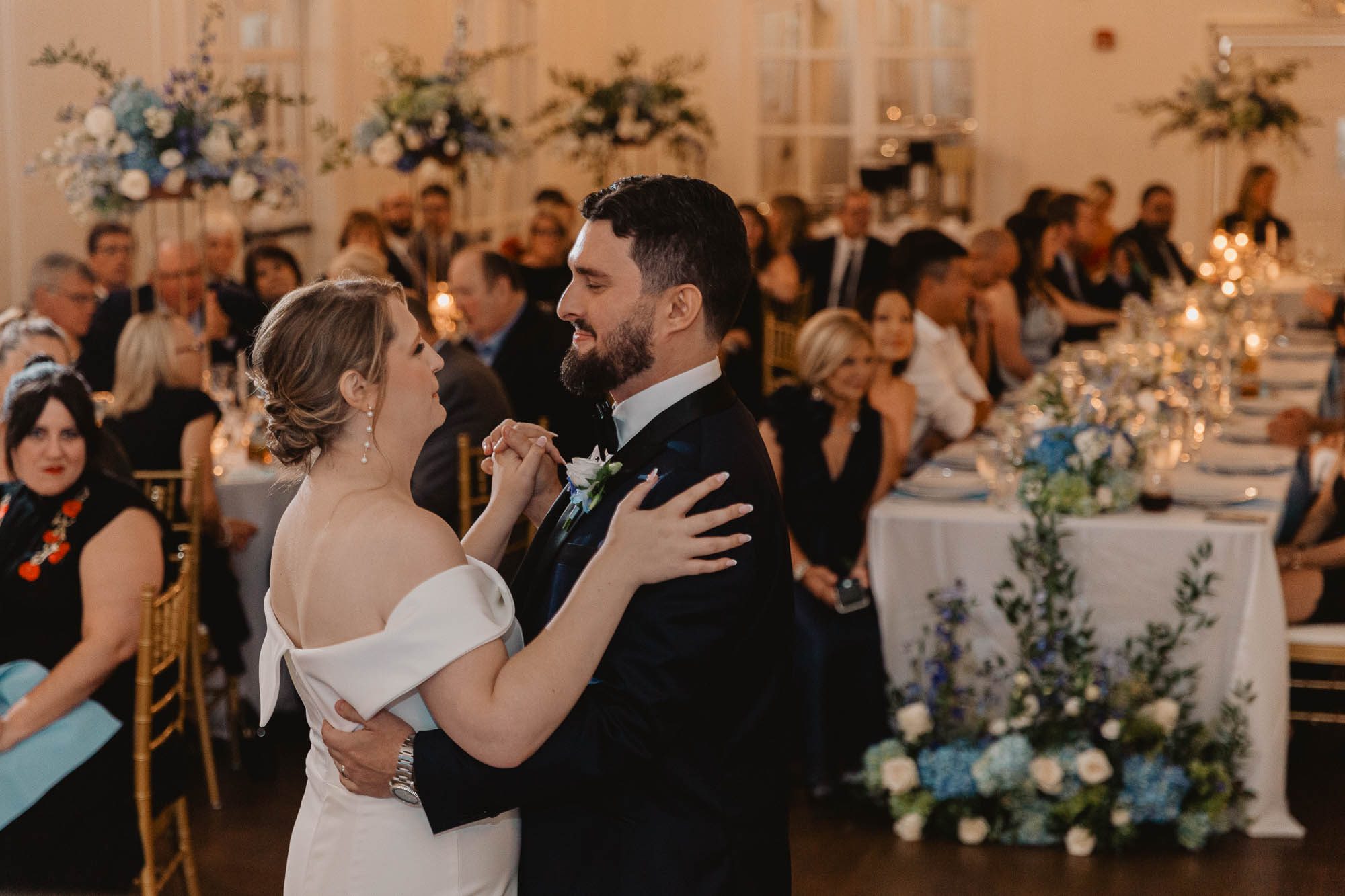 A bride and a groom enjoy their first dance together in the ballroom of Atlanta's historic Wimbish house on their wedding day