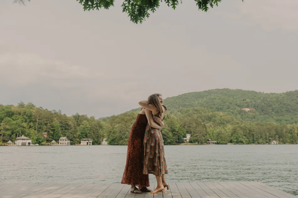 Two women embracing after a romantic Lakeside proposal in north, Georgia