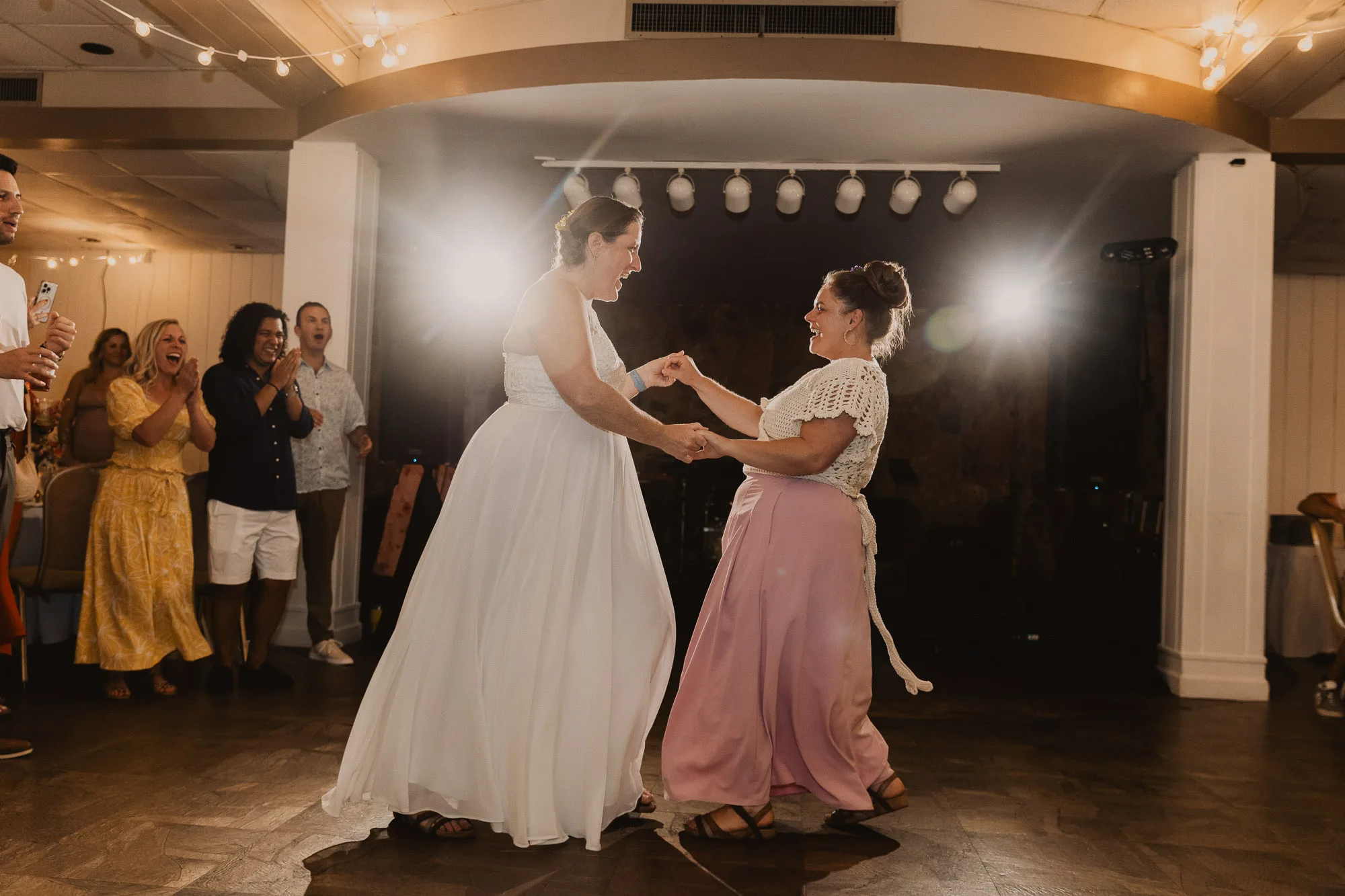 two brides wearing white dresses enjoy their first dance on their wedding day at Joe Wheeler State Park in northwest Alabama