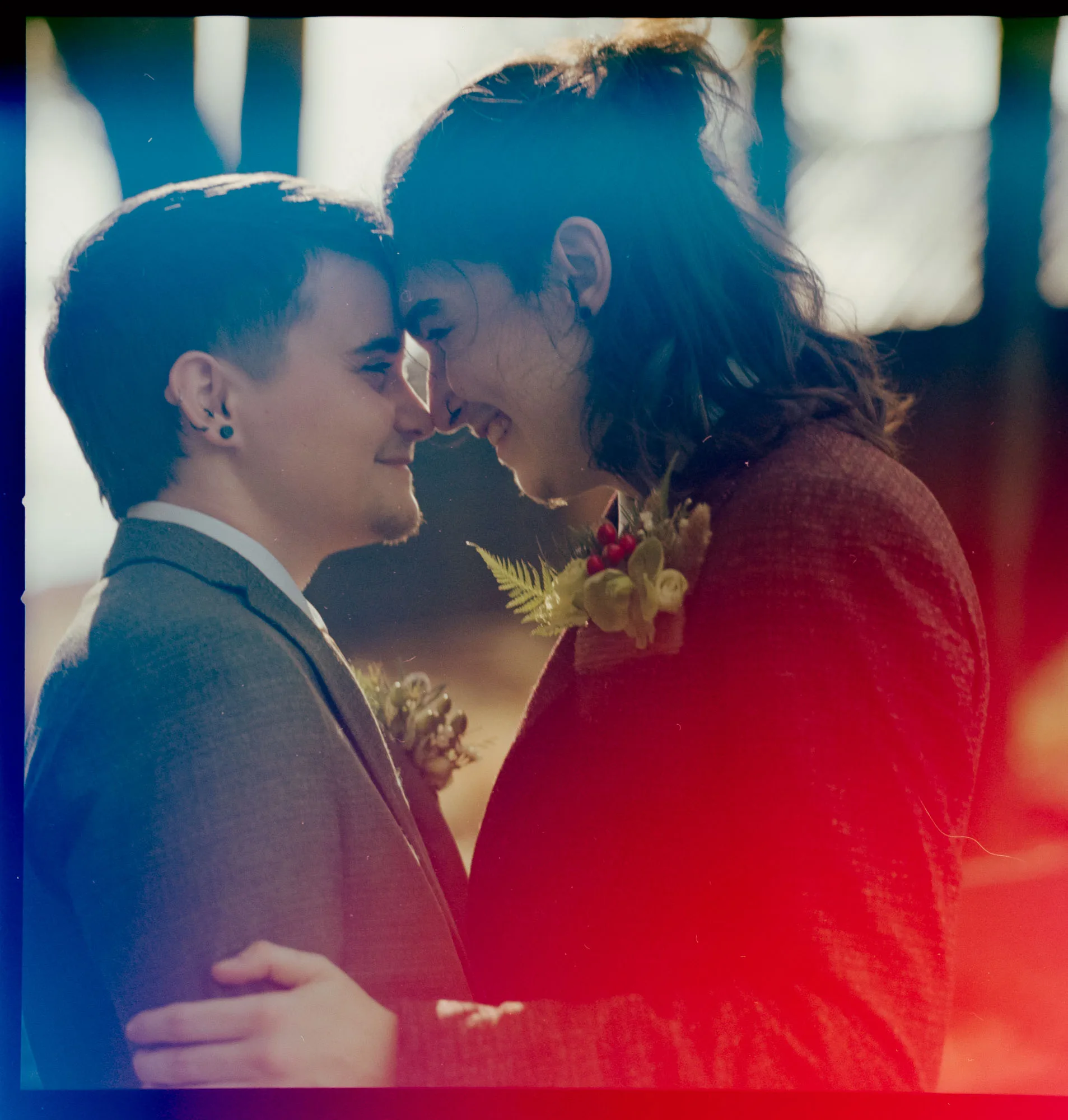 film photo of a couple happily embracing on their wedding day at the inn at serenbe